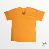 The back of a printed graphic orange t-shirt "The River Is In My Soul".
