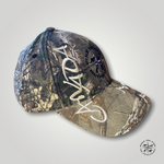 The back of Canada Realtree camo hat with embroidered Pike Island compass logo.